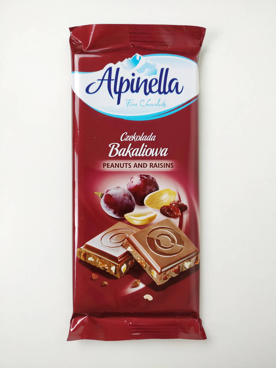 Шоколад "Alpinella Czekolada Peanuts and Raisins" (Альпінелла молочний з арахісом та родзинками)
Шоколад "Alpinella Czekolada Peanuts and Raisins" (Альпінелла молочний з арахісом та родзинками)