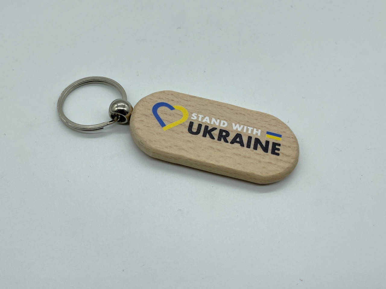 Брелок деревянный с гравировкой. MADE IN UKRAINE. 65х30мм 
Брелок деревянный с гравировкой. MADE IN UKRAINE. 65х30мм