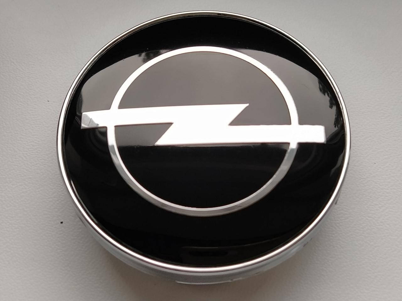 Колпачки заглушки в литые диски Opel 60/56/10 мм. Черные 
Колпачки заглушки в литые диски Opel 60/56/10 мм. Черные