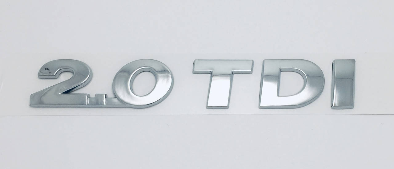 Эмблема надпись багажника VW Volkswagen 2.0 TDI Caddy Touran Tiguan после 2009 
Эмблема надпись багажника VW Volkswagen 2.0 TDI Caddy Touran Tiguan после 2009