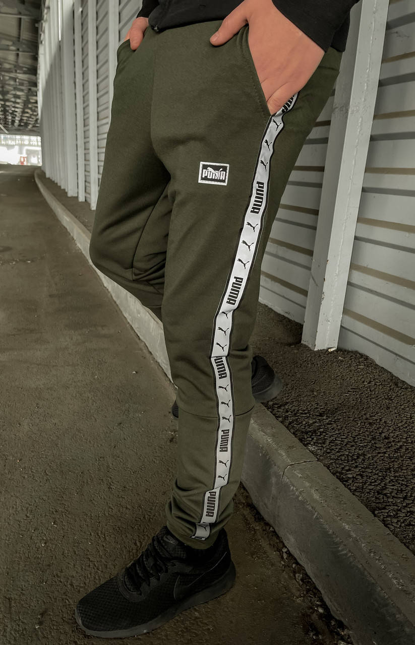 Молодежные спортивные штаны мужские Puma из трикотажа на манжетах с лампасами весна-осень хаки,
Молодежные спортивные штаны мужские Puma из трикотажа на манжетах с лампасами весна-осень хаки,