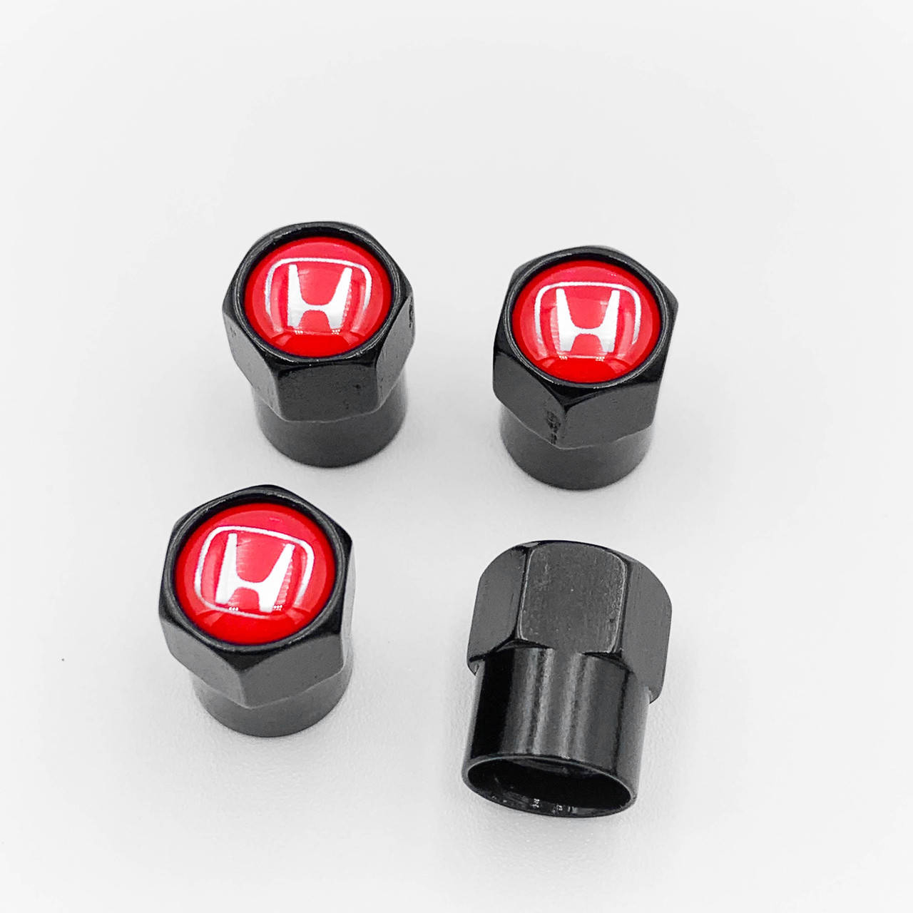 Защитные колпачки на ниппеля HONDA (Хонда) 4 шт Красный фон Черные 
Защитные колпачки на ниппеля HONDA (Хонда) 4 шт Красный фон Черные