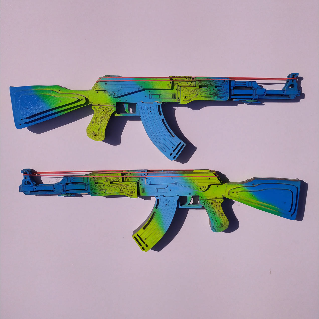 Деревянный Автомат Калашникова (АК-47) из CS:GO (КС:ГО) Стреляющий Резинками. Цвет: Сине-Зеленый Градиент.
Деревянный Автомат Калашникова (АК-47) из CS:GO (КС:ГО) Стреляющий Резинками. Цвет: Сине-Зеленый Градиент.