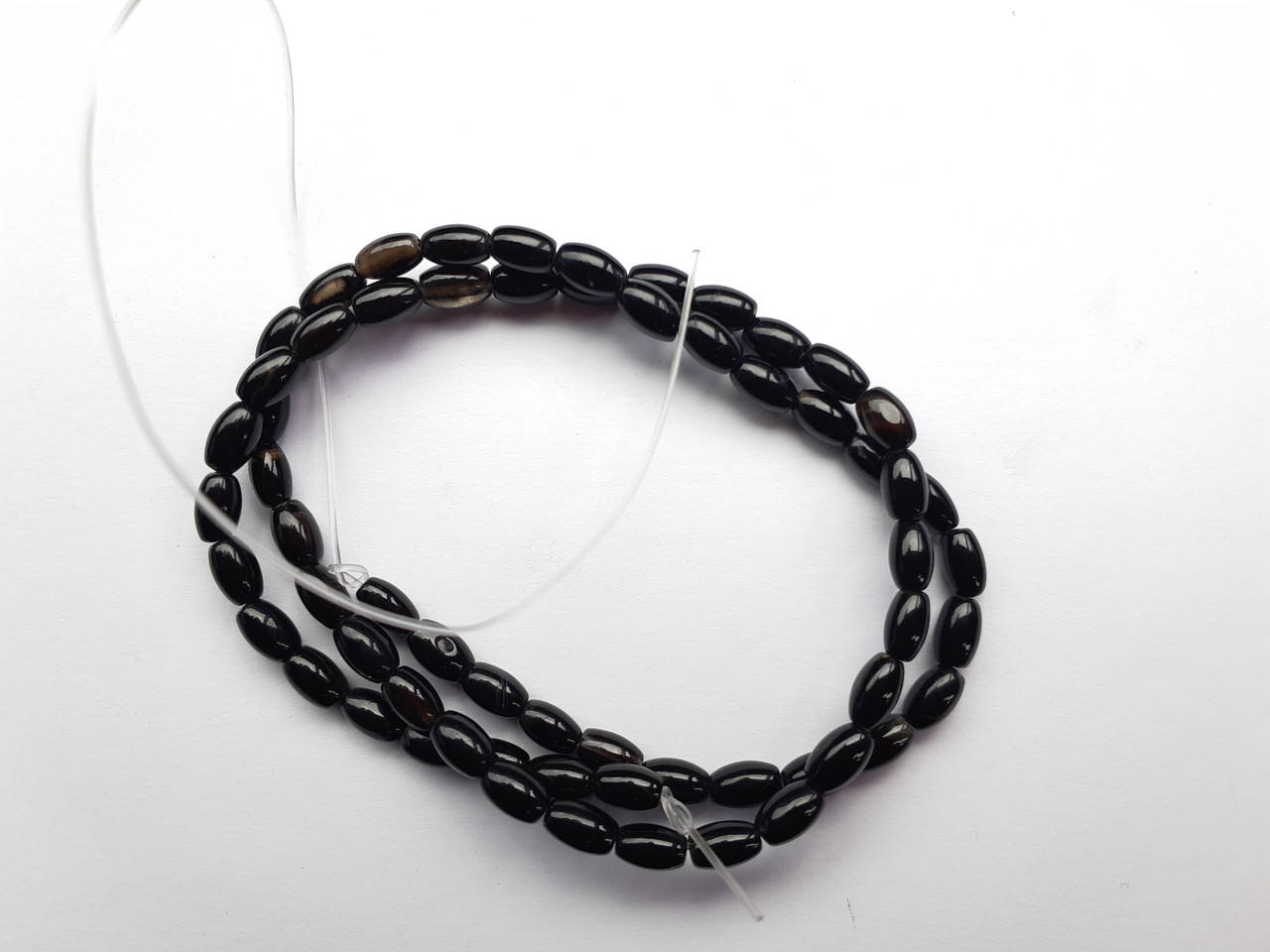 

Бусины на нитке Агат d-5x6,5мм L-37см