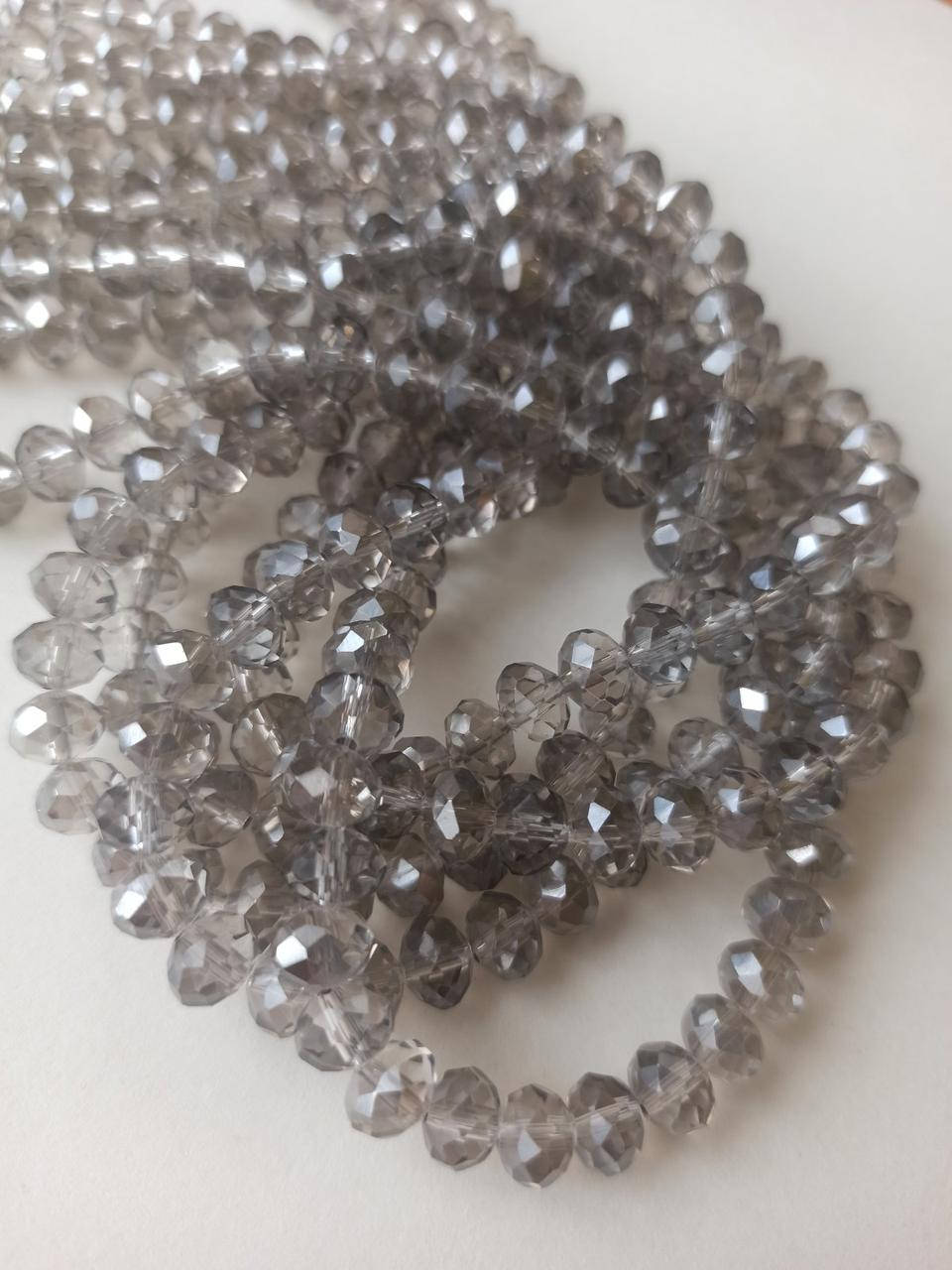 

Хрустальные бусины (рондель) 8*5 мм, пачка 70 шт. цвет - дымчатый с переливом, Серый