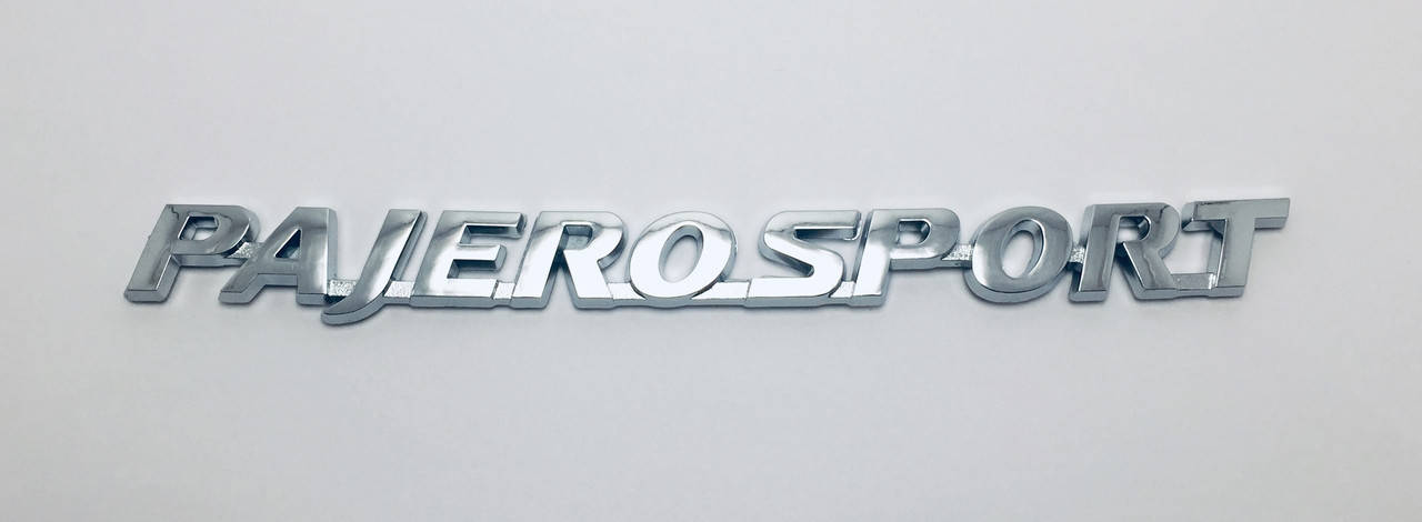 

Эмблема надпись багажника Mitsubishi Pajero Sport