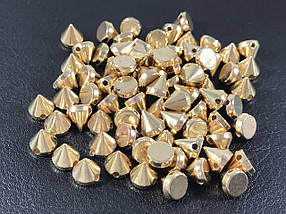 Шипи пластикові пришивні кольори золото 8х7 мм поштучно/паковання