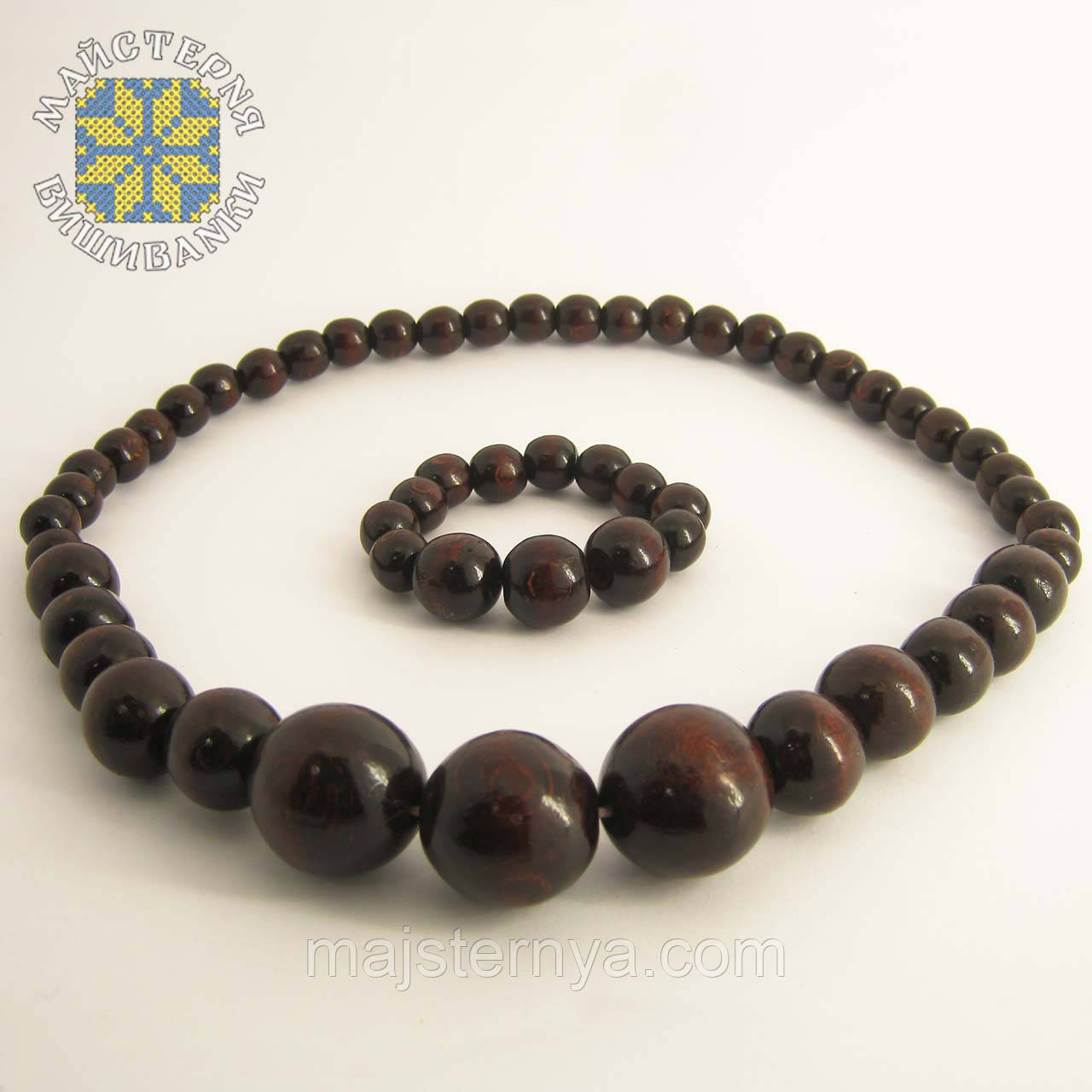 Дерев'яні буси з браслетом із намистин розміром від 11мм до 26мм коричневий