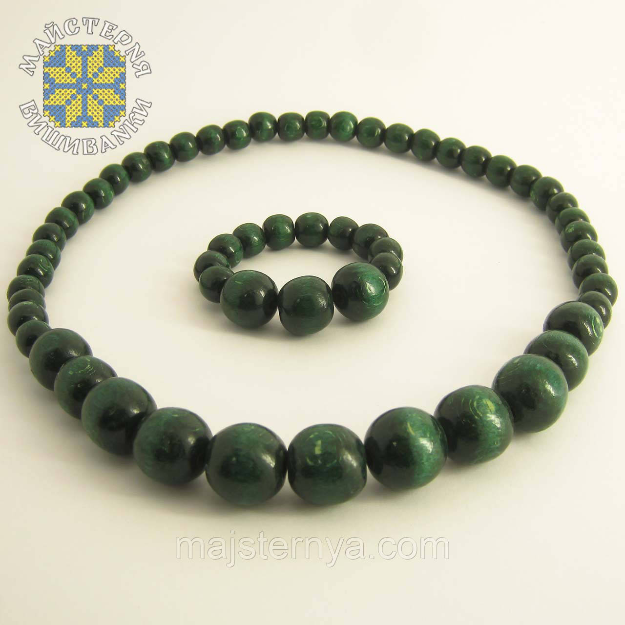 Дерев'яні буси з браслетом із намистин розміром від 11мм до 26мм зелений (темний)