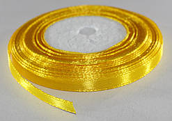 Стрічка атласна. Колір — жовтий насичений. Ширина — 0,7 см, довжина — 23 м