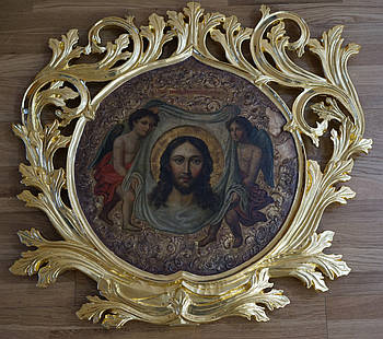 Сусальне золочення різьби на старовинній іконі.