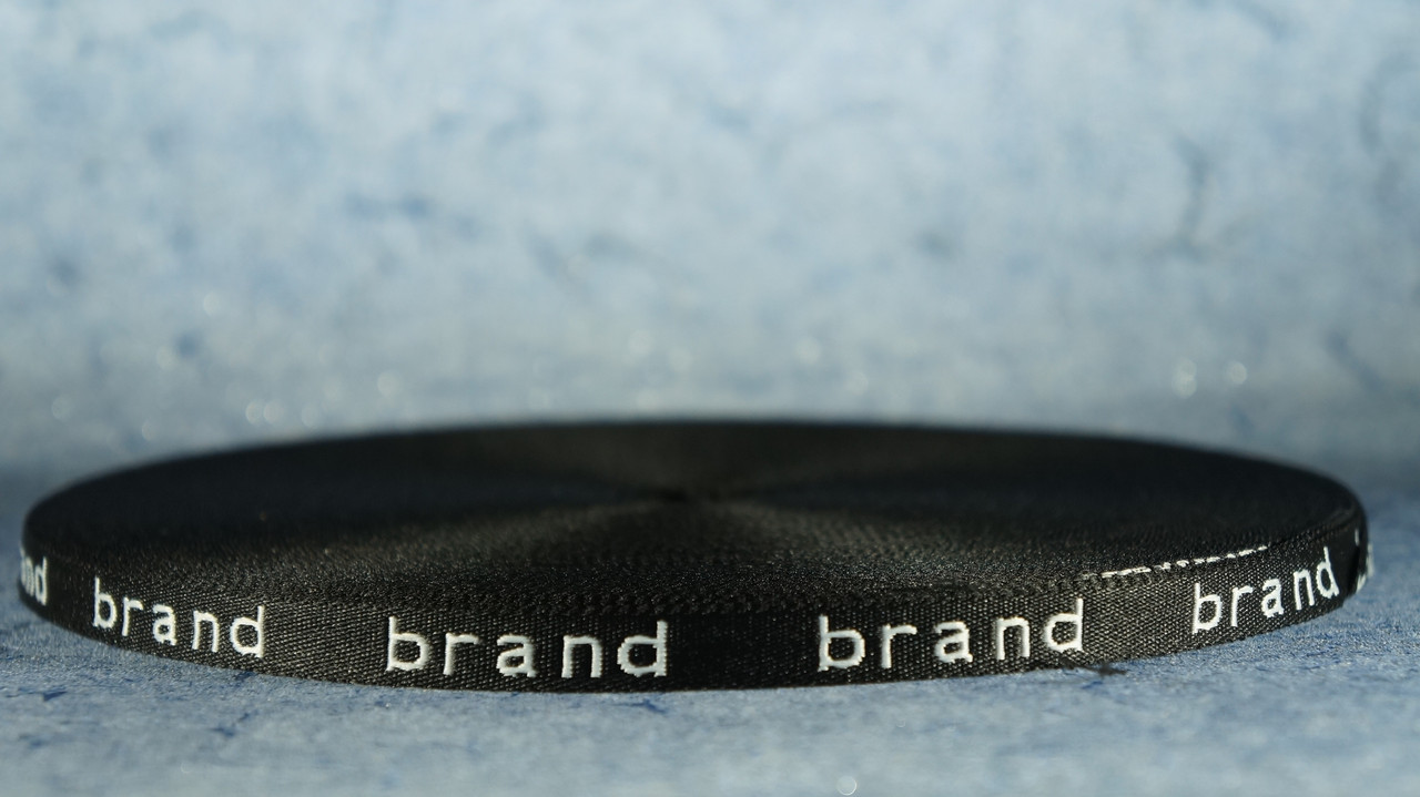 Стрічка з логотипом 10 мм чорна/біла "Brand" 50 м