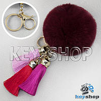 Бордовый пушистый брелок шарик из натурального меха с кольцом, карабином и разноцветными кисточками, на сумку