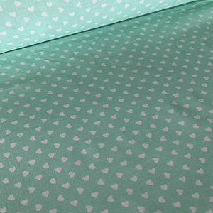 Бавовняна тканина ЛЮКС білі серця (дрібні) на м'ятному (0215)