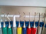 Набір інструментів для зняття зубних відкладень з 9 предметів з силіконовими ручками в стерилізаторі, фото 4