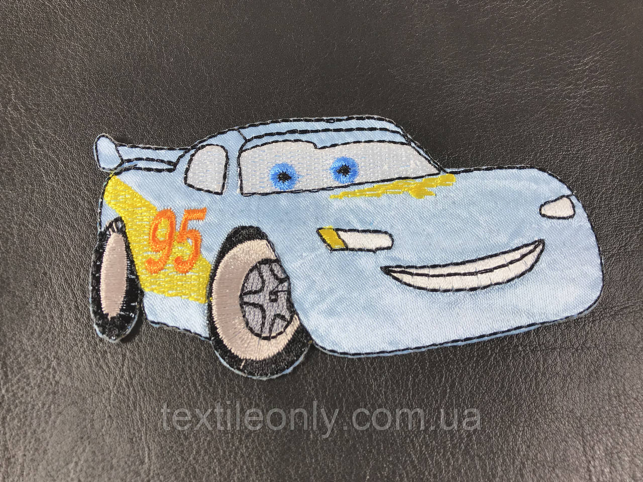 Нашивка Макквін колір блакитний 118х63 мм