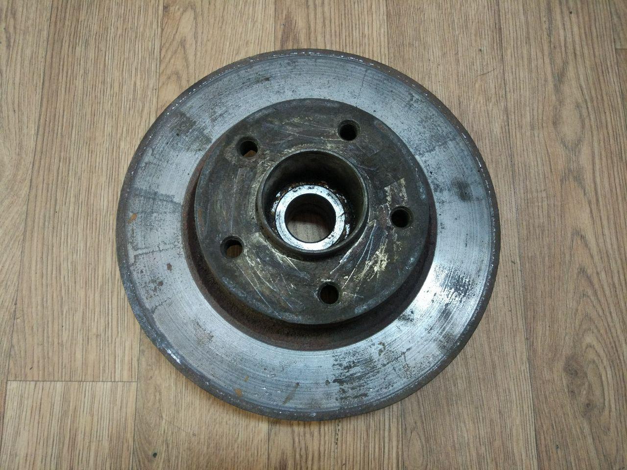 Гальмівний диск задній з підшипником (з ABS) Renault Trafic, Opel Vivaro 2001-2014, 7711130076 (Б/У)