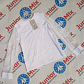 Ошатна біла дитяча шкільна блузка для дівчаток гуртом AGATKA. ПОЛЬША