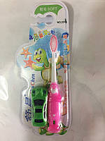 Зубна щітка дитяча з іграшкою.