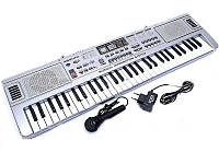 Синтезатор, пианино, орган детский. 61 клавиша, микрофон, FM радио. Модель приближенная к профессиональному.