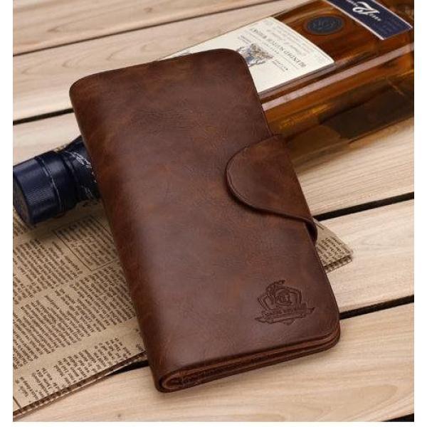 Місткий чоловічий гаманець на кнопці, вертикальне шкіряне портмоне чоловіче, фото 1