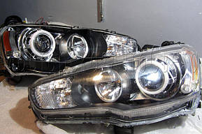 Mitsubishi Lancer X - установка биксеноновых линз Moonlight SUPER G5 2,5" дюйма и "ангельских глазок" LED  2