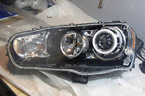 Mitsubishi Lancer X - установка биксеноновых линз Moonlight SUPER G5 2,5" дюйма и "ангельских глазок" LED  3