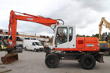 Колісний екскаватор CAT M315.