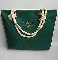 Пляжна сумка Gucci з канатними ручками.
