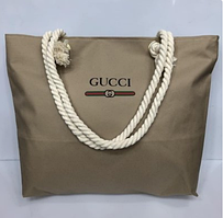 Пляжна сумка Gucci з канатними ручками.