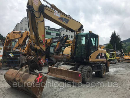 Колісний екскаватор CATERPILLAR M318D.