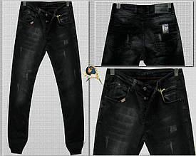 Модні чоловічі завужені джинси на гумці-манжеті чорного кольору з потертостями