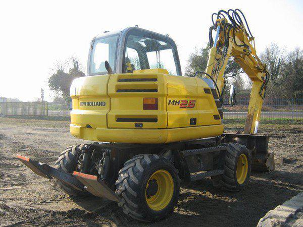 КОЛІСНИЙ ЕКСКАВАТОР NEW HOLLAND MH 2.6, фото 1