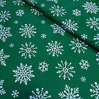 Тканина з великими білими сніжинками на зеленому тлі, ширина 160 см