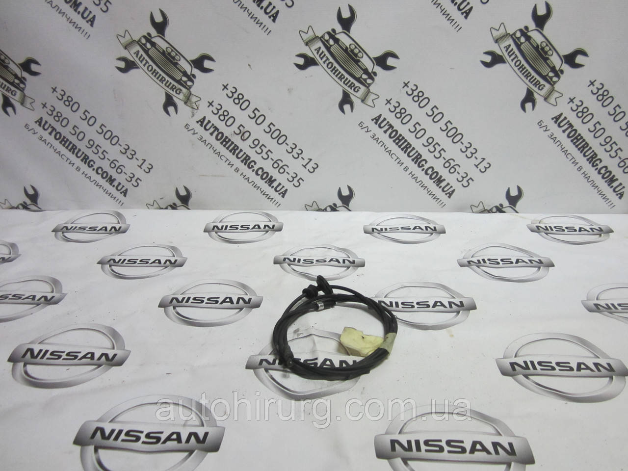 Тросик відкриття капота Nissan Navara D40 (65621 EB300)