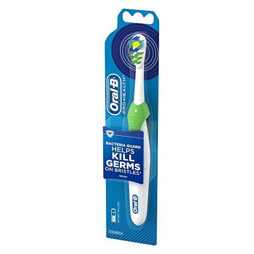 Зубна щітка Oral-B Cross Action 3D White на батарейці, B1010F зелена, фото 1