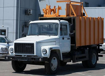 Сміттєвоз 7 м3 з бічної механічної завантаженням на шасі ГАЗ-3309, фото 2