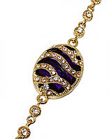 Браслет. Позолота. Камені: фіолетовий та білий циркон. Довжина: 18,3 см. Ширина: 21 мм.