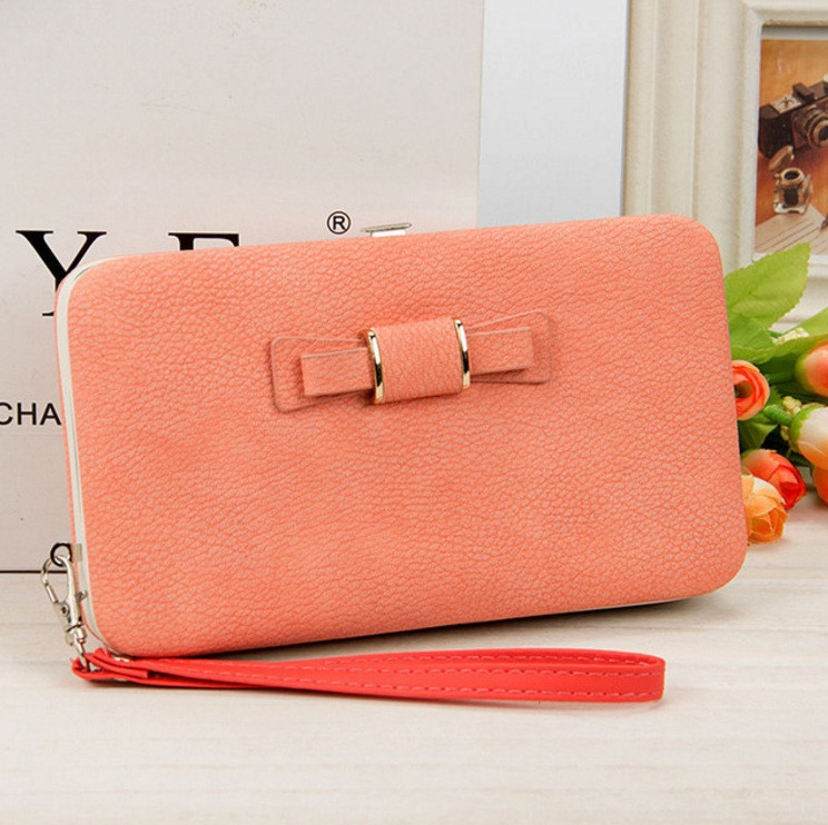 Модний жіночий клатч з бантиком персиковий