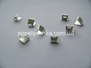 Затискачі для шнурів, Стоппери.