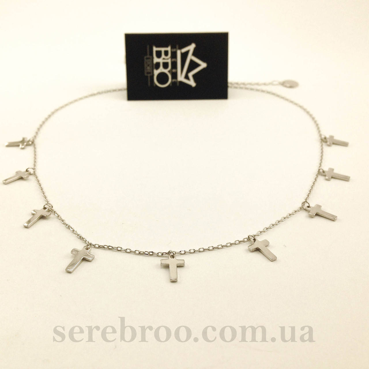 

Серебряное колье с крестиками