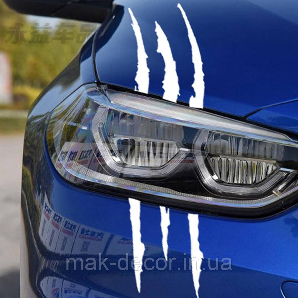 Вінілові наклейки на авто " Подряпини на фари " 12х40 см на 2 фари