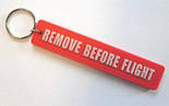 Гумові брелоки Remove before flight під замовлення з вашим логотипом, фото 2