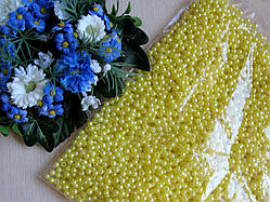 Перли жовтий діаметр 0,4 см Вага упаковки 100 г приблизно 3500 шт.