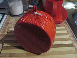 Зріжте зайвий край пакета.