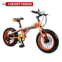 Оранжевый детский горный велосипед со скоростями и дисковыми тормозами