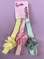 Набор детских повязок на голову нежных розовых желтых и мятных с цветочками фирмы Claire s