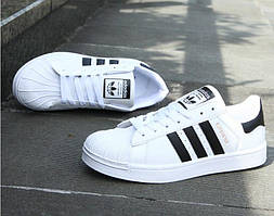 Кросівки білі з чорними смужками 40-й розмір