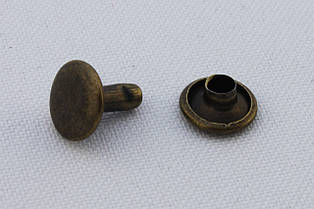 Хольнитен двосторонній, діаметр - 9 мм, ніжка - 9 мм, колір - антик, в упаковці - 100 шт, артикул СК 5149