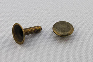 Хольнітен односторонній, діаметр - 9 мм, ніжка - 12 мм, колір - антик, в упаковці - 100 шт, артикул СК 5218
